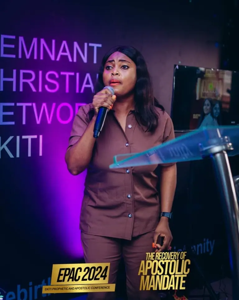 A woman ministering at the lectern during EPAC 2024