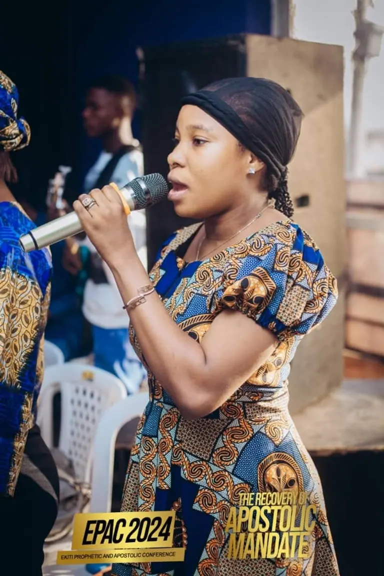 A woman singing into a microphone at EPAC 2024